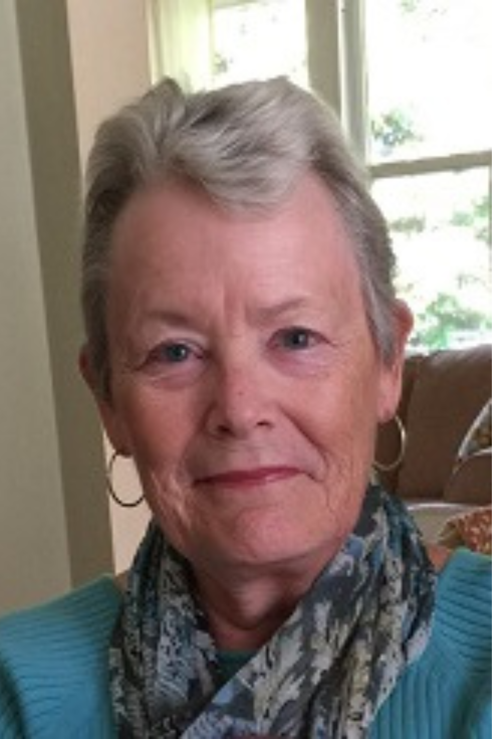 Portrait of Connie Garcia, a dedicated Realtor with expertise in tax law and a diverse real estate background, showcasing her professional demeanor.