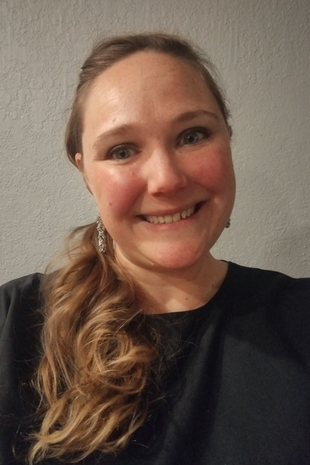 Portrait of Danielle Lang, a Realtor with a distinctive blend of research, teaching, and counseling skills, enhancing her real estate expertise.